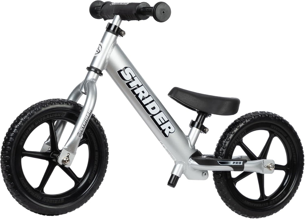 Strider 12' Pro Bike, No Pedal Balance Bicycle for Kids 1 to 4 Years - Includes Safety Pad, Padded Seat, Mini Grips & Flat-Free Tires - Tool Free