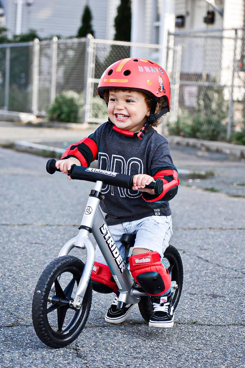 Strider 12' Pro Bike, No Pedal Balance Bicycle for Kids 1 to 4 Years - Includes Safety Pad, Padded Seat, Mini Grips & Flat-Free Tires - Tool Free