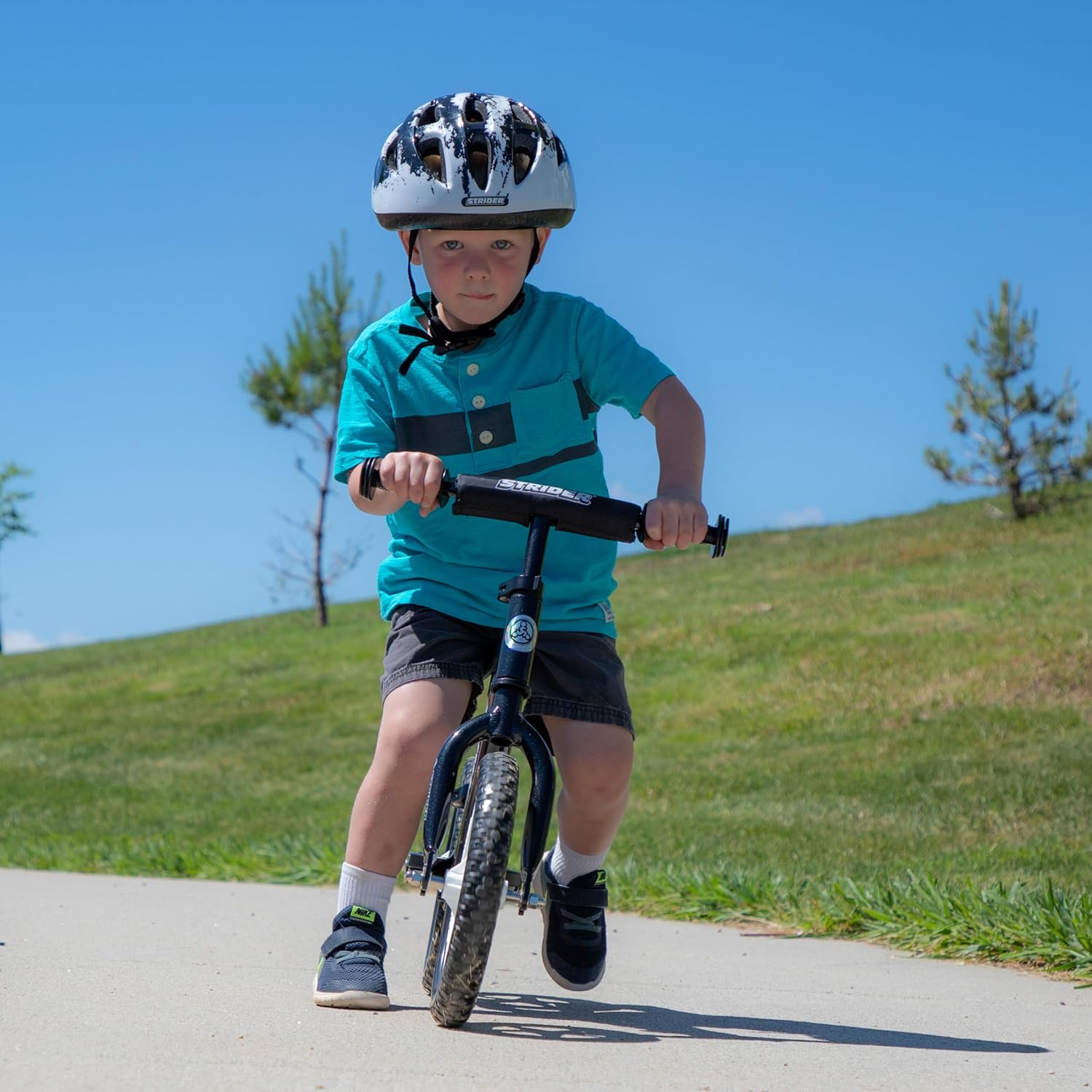 Strider 12' Pro Bike, No Pedal Balance Bicycle for Kids 1 to 4 Years - Includes Safety Pad, Padded Seat, Mini Grips & Flat-Free Tires - Tool Free