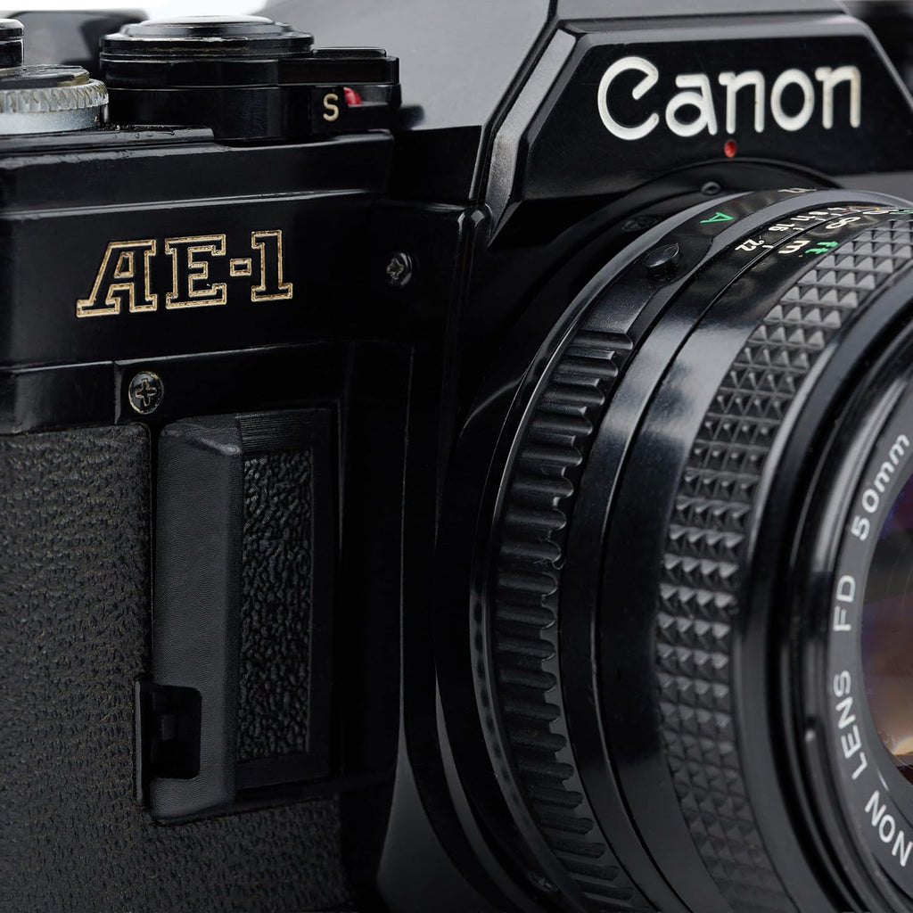 Canon AE-1 35mm SLR Film Manual Focus Camera (Black) with 50MM Canon FD Mount Lens. (Renewed)