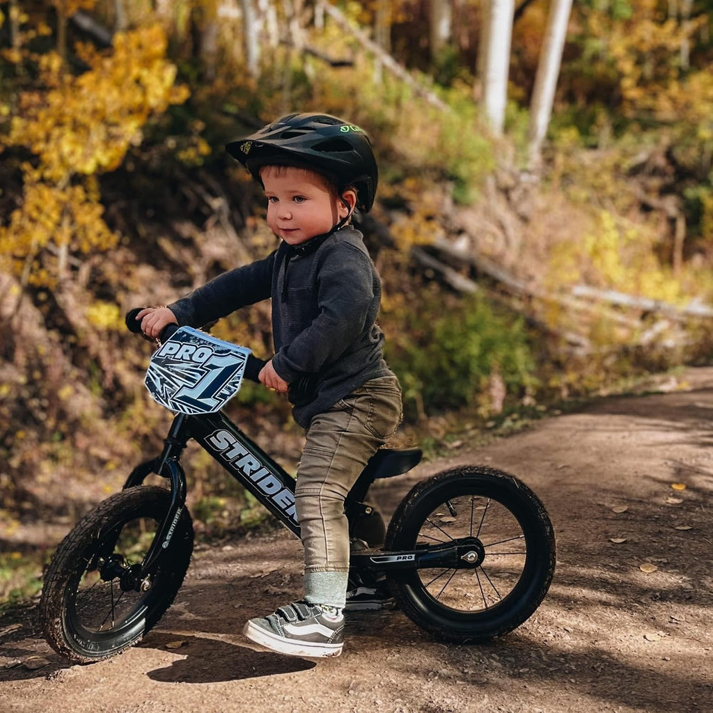Strider 12' Pro Bike, No Pedal Balance Bicycle for Kids 1 to 4 Years - Includes Safety Pad, Padded Seat, Mini Grips & Flat-Free Tires - Tool Free